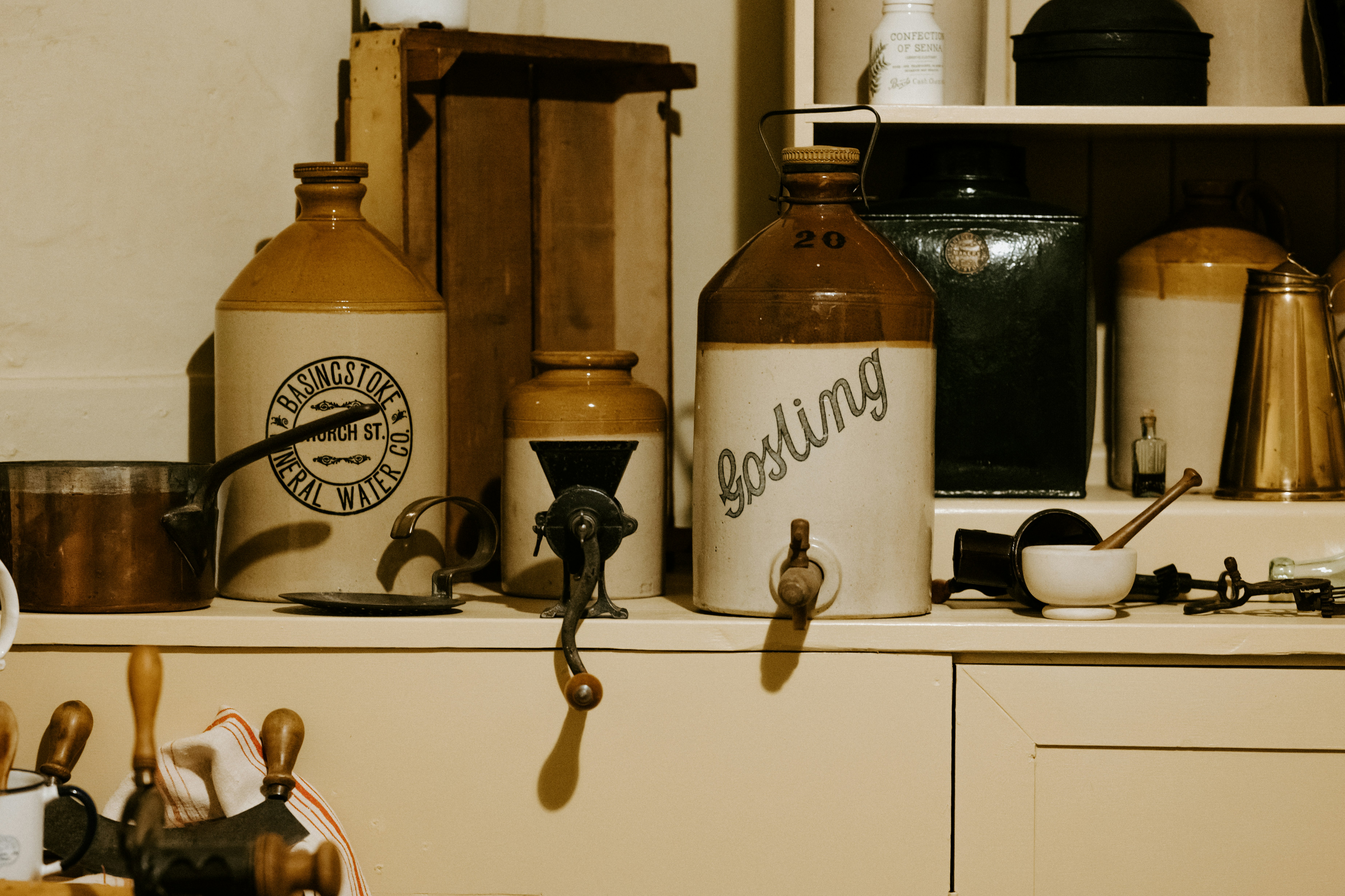 white-and-brown earthenware jugs